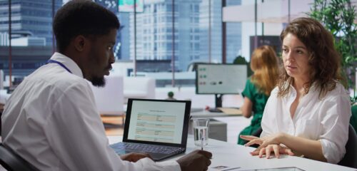 Staff interviewing woman applicant job seeker in high end office