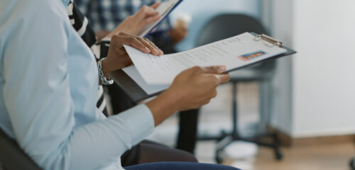Female candidate sitting in queue and receiving cv files