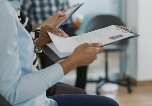 Female candidate sitting in queue and receiving cv files